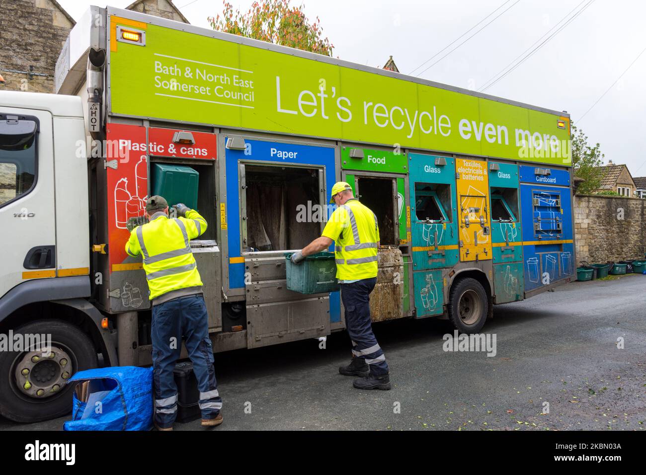 Council workers collect recycling refuse on a specially designed truck in Batheaston, Somerset, England, UK Stock Photo