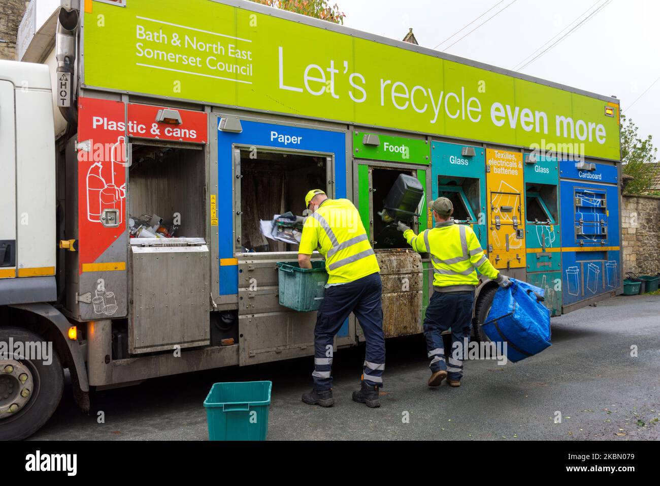 Council workers collect recycling refuse on a specially designed truck