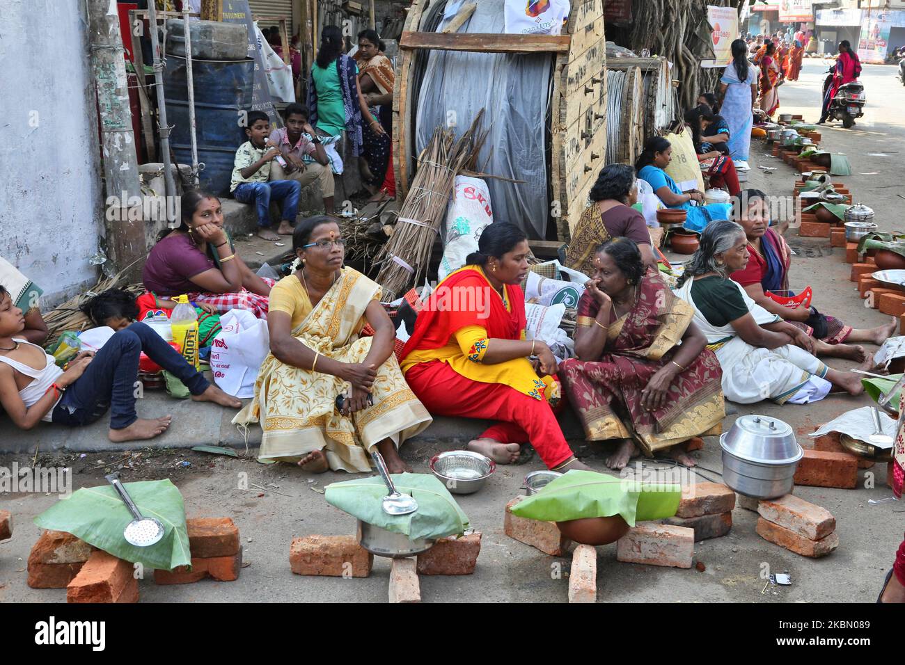 hindu-women-finish-final-preparations-and-wait-for-the-signal-to-begin