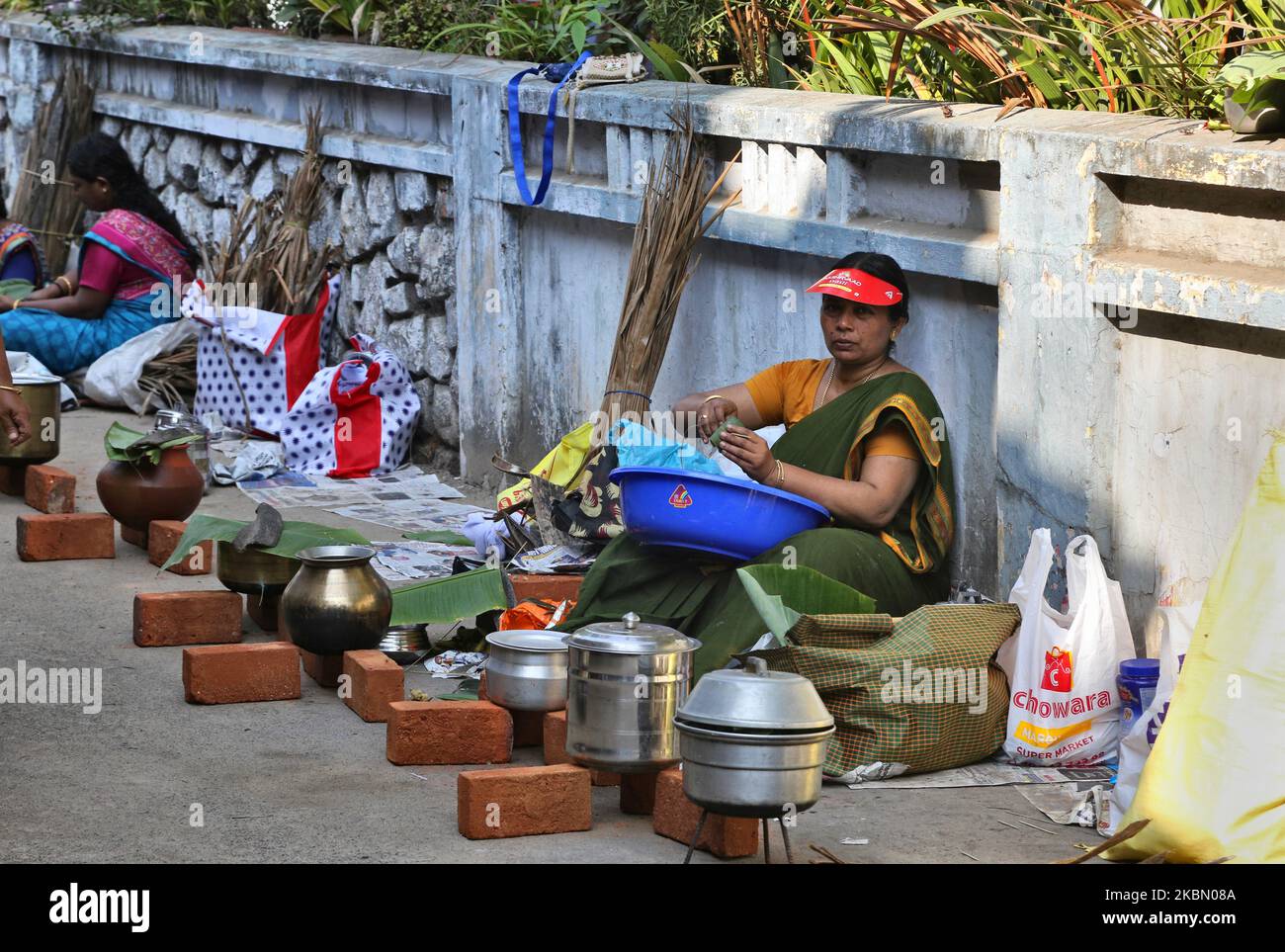 hindu-women-finish-final-preparations-and-wait-for-the-signal-to-begin