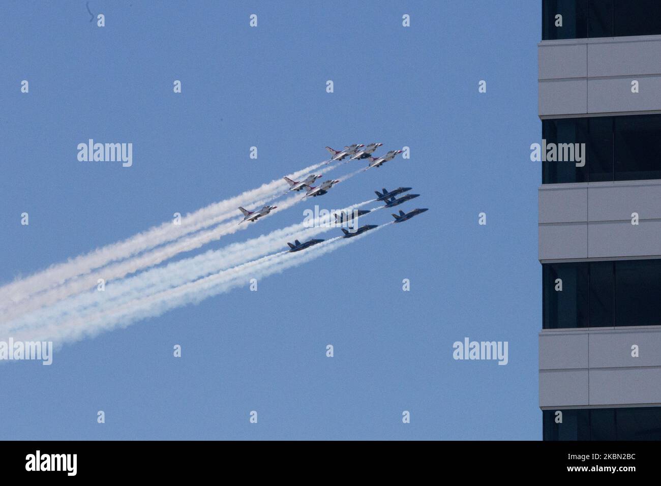 The Navy Blue Angels and Air Force Thunderbirds fly over downtown Philadelphia as a display of