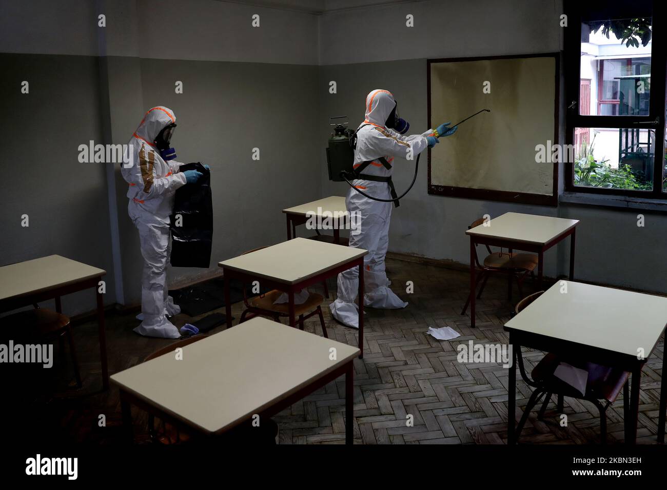Portuguese Soldiers wearing protective gear disinfect a high school as the spread of the COVID-19 coronavirus disease continues, in Lisbon, Portugal on April 29, 2020. As Portugal's state of emergency will end on May 2 and the Government expected to reopen high schools in mid-May, more than 400 members of the country's armed forces are carrying out the disinfection of schools. (Photo by Pedro Fiúza/NurPhoto) Stock Photo