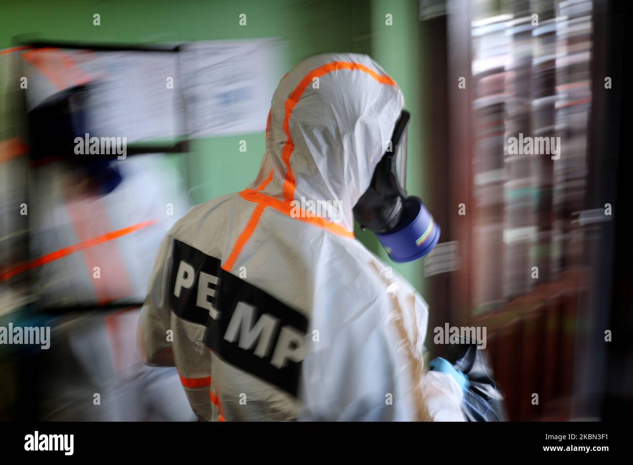 Portuguese Soldiers wearing protective gear disinfect a high school as the spread of the COVID-19 coronavirus disease continues, in Lisbon, Portugal on April 29, 2020. As Portugal's state of emergency will end on May 2 and the Government expected to reopen high schools in mid-May, more than 400 members of the country's armed forces are carrying out the disinfection of schools. (Photo by Pedro FiÃºza/NurPhoto) Stock Photo