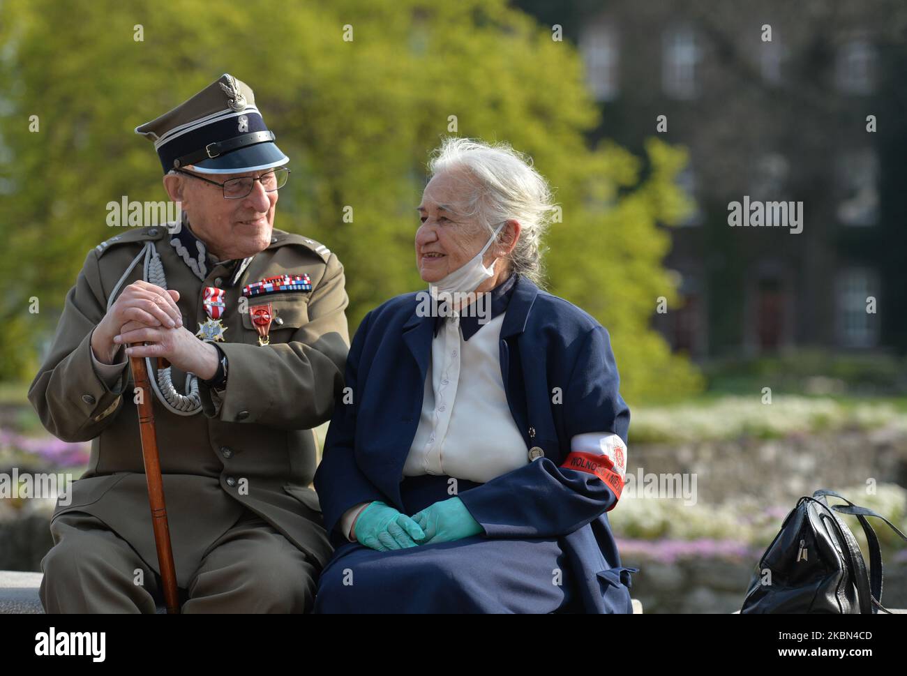 Jadwiga Ostafin-Martyna, daughter of Capt. Jozef Ostafin sentenced to death in one of the most famous trials of post-war Poland, meets with Major Stanislaw Szuro (age 99), Sachsenhausen Nazi concentration camp survivor, at Wawel Cathedral ahead of a mass-ceremony marking the 75th anniversary of the liberation of the former Nazi concentration camps in Sachsenhausen, Dachau and Ravensbruck. Sachsenhausen-Oranienburg was liberated on April 22, 1945, Dachau on April 29, 1945 and Ravensbruck on April 29–30, 1945. The initiative to celebrate this mass came from the associations of the last prisoners Stock Photo