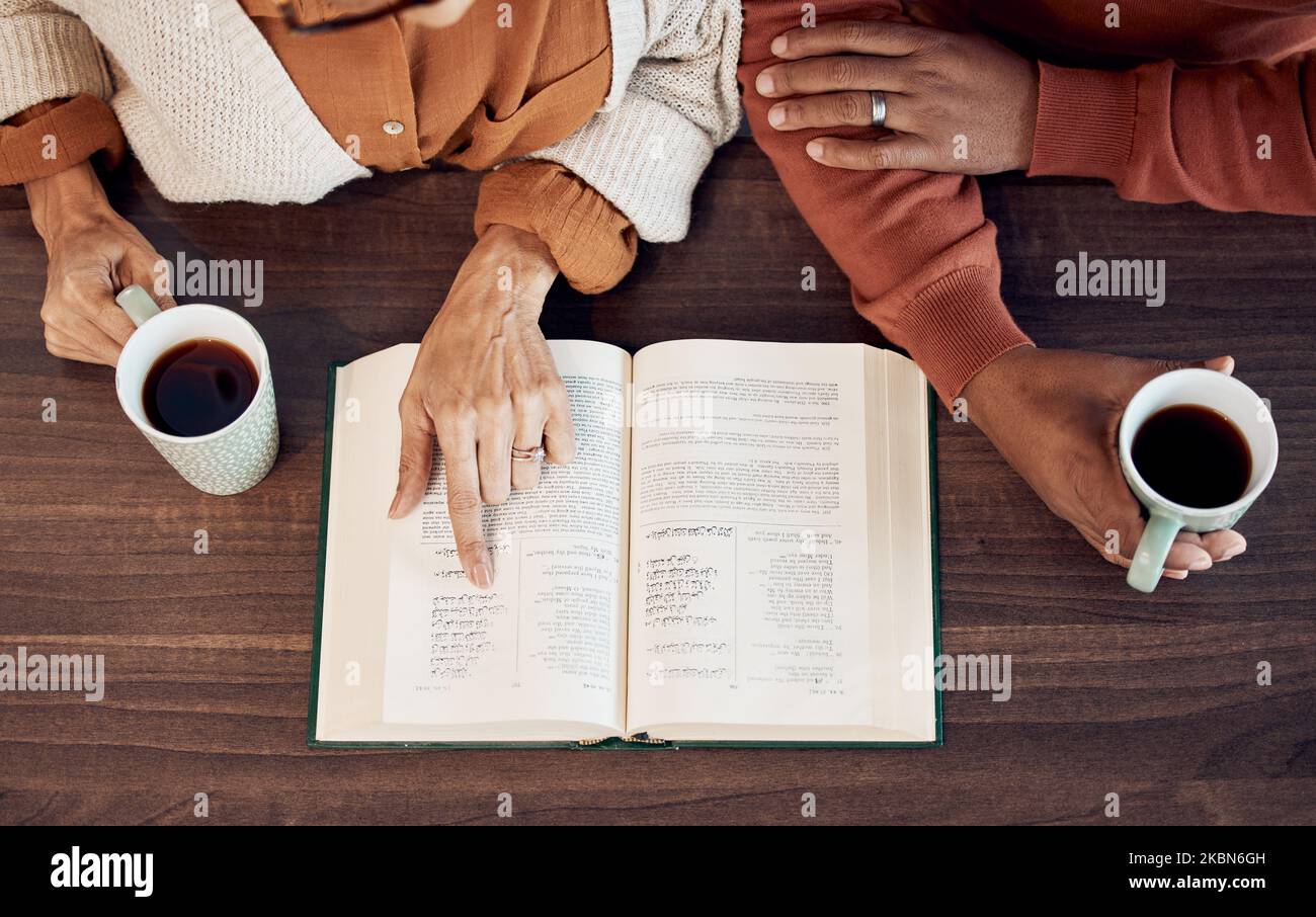 Muslim, islamic quran and women hands drinking coffee in the morning with a worship and faith book. Above view of reading, hope text and information Stock Photo