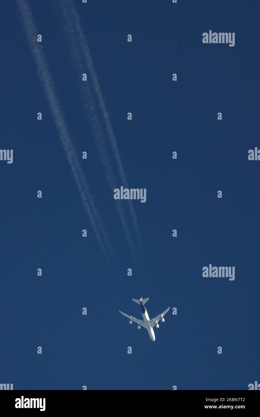 A Lufthansa Boeing 747-400 aircraft as seen flying over Greece in the blue sky at 34.000 feet leaving a vapour trail or contrail behind. DLH LH operates 38 Boeing 747 ( 13 B744 and 19 747-8 ). The large double decker, wide-body overflying plane is the airliner also know as Queen of the Skies is the longest passenger airplane flying made for long haul flights and is powered by 4 jet engines. Lufthansa uses the 747s for flights to Asia and America departing from Frankfurt and Munich but also carrying cargo supplies during the COVID-19 Coronavirus pandemic outbreak era or operating rescue flights Stock Photo