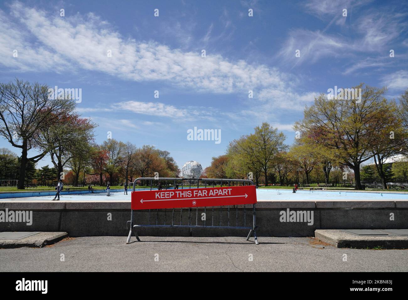 A view people enjoying the weather at Flushing Meadows Corona Park