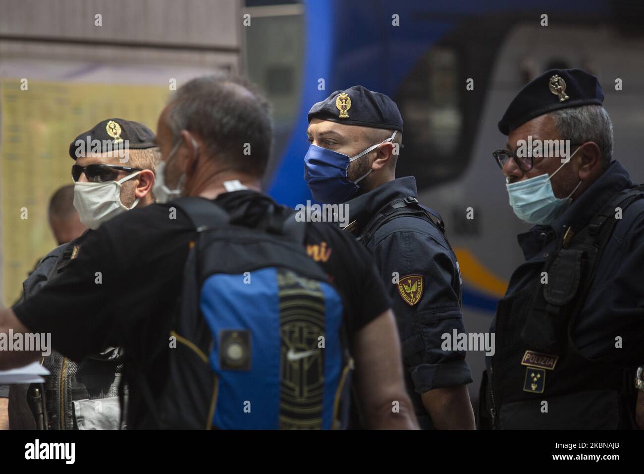 Law enforcement agents patrolling the train Central Station in Naples