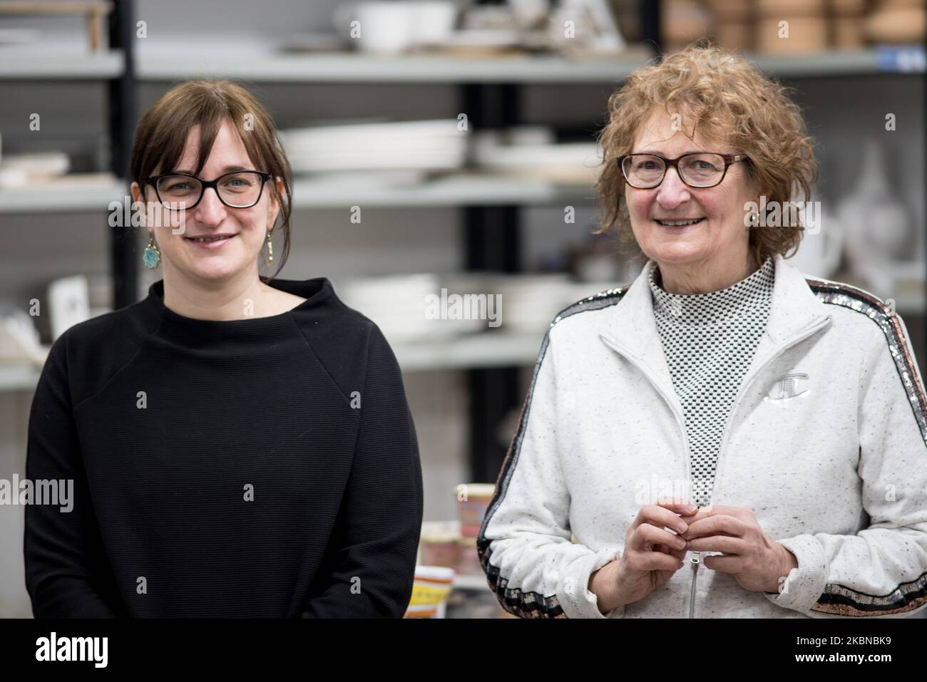 Elisa Suzzi, ceramic decorator, inside her workshop, La Vecchia Faenza, and her mother, Laura Silvagni. Her production is characterized by fidelity to the decorative tradition of Faenza, in its broad lines unchanged since the fifteenth century, although revised and reinterpreted. The workshop is closed because of the coronavirus and only Elisa and her mother, Laura Silvagni, work at a reduced rate. Faenza, 18th April 2020. (Photo by Andrea Savorani Neri/NurPhoto) Stock Photo