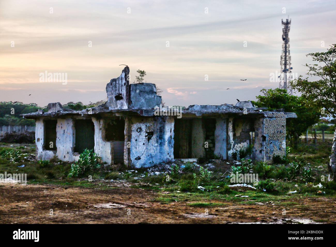 Remains of a home riddled with bullet holes and that was destroyed ...