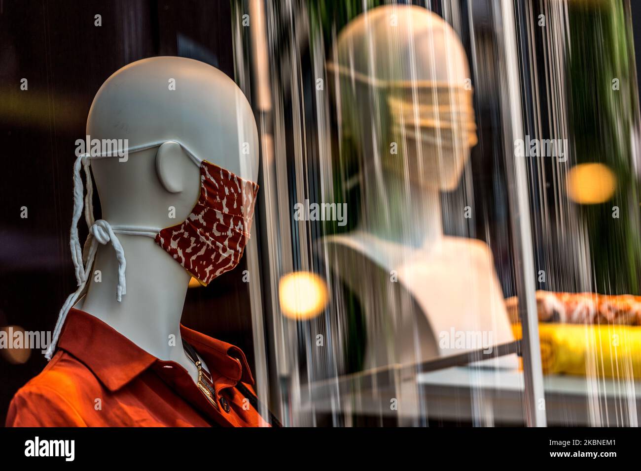Display mannequins can be seen in the front of the shop display window with face mask in Antwerp - Belgium 07 May 2020. Belgium compulsory face mask on public transport and strongly recommended in other places. Belgium will start cautiously on 4 May with a way out of the corona measures. Stores will reopen again on May 11 under certain conditions. Jonathan Raa / Nurphoto (Photo by Jonathan Raa/NurPhoto) Stock Photo