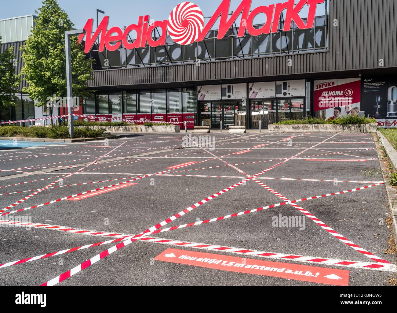 The entrance of Media markt with stickers to help people keep their  distance in Oostakker, Belgium