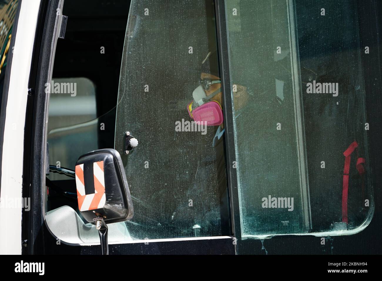 A view of an MTA Bus driver wearing a mask in New York City USA during the coronavirus pandemic on May 9, 2020 in New York City. COVID-19 has spread to most countries around the world, claiming over 270,000 lives with over 3.9 million infections reported. (Photo by John Nacion/NurPhoto) Stock Photo