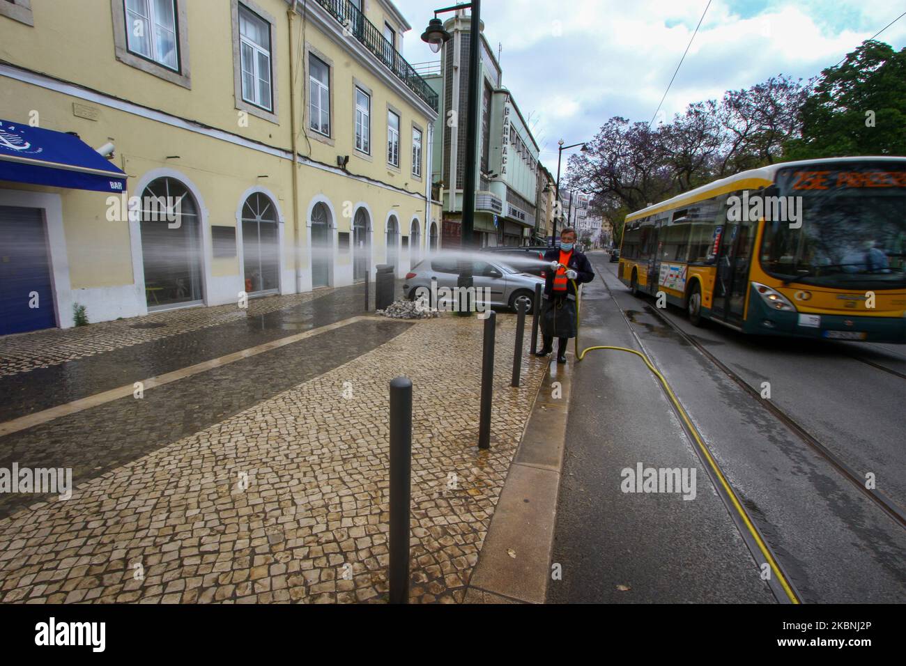 An Urban Hygiene team washes with sodium hypochlorite the streets of the Estrela district in Lisbon considered most critical such as heavily populated and tourist areas, also those associated with transport interfaces, restaurants and other commercial outlets. 10 May, 2020. Despite the lifting of the emergency measures which limited the free transit and the imposition of an obligatory quarantine, the institutions belonging to the Portuguese government continue to carry out their projects to support the citizen in the face of the advance of the COVID-19. The Estrela Community Council has been a Stock Photo