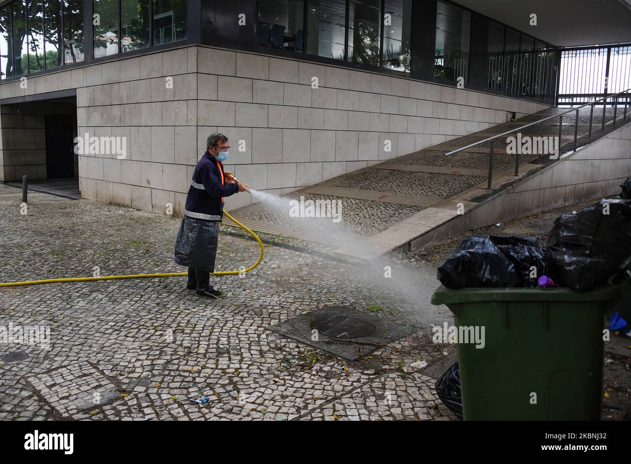 An Urban Hygiene team washes with sodium hypochlorite the streets of the Estrela district in Lisbon considered most critical such as heavily populated and tourist areas, also those associated with transport interfaces, restaurants and other commercial outlets. 10 May, 2020. Despite the lifting of the emergency measures which limited the free transit and the imposition of an obligatory quarantine, the institutions belonging to the Portuguese government continue to carry out their projects to support the citizen in the face of the advance of the COVID-19. The Estrela Community Council has been a Stock Photo
