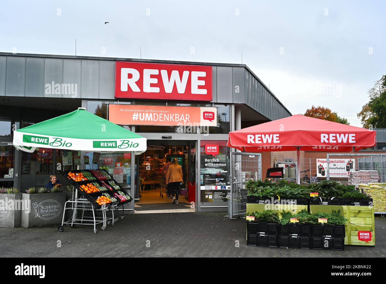 Entrance of a Rewe supermarket Stock Photo