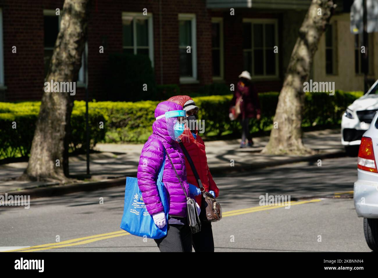 A view of people wearing face shields and masks during the coronavirus pandemic on May 12, 2020 in Queens borough of New York City. COVID-19 has spread to most countries around the world, claiming over 270,000 lives with over 3.9 million infections reported. (Photo by John Nacion/NurPhoto) Stock Photo