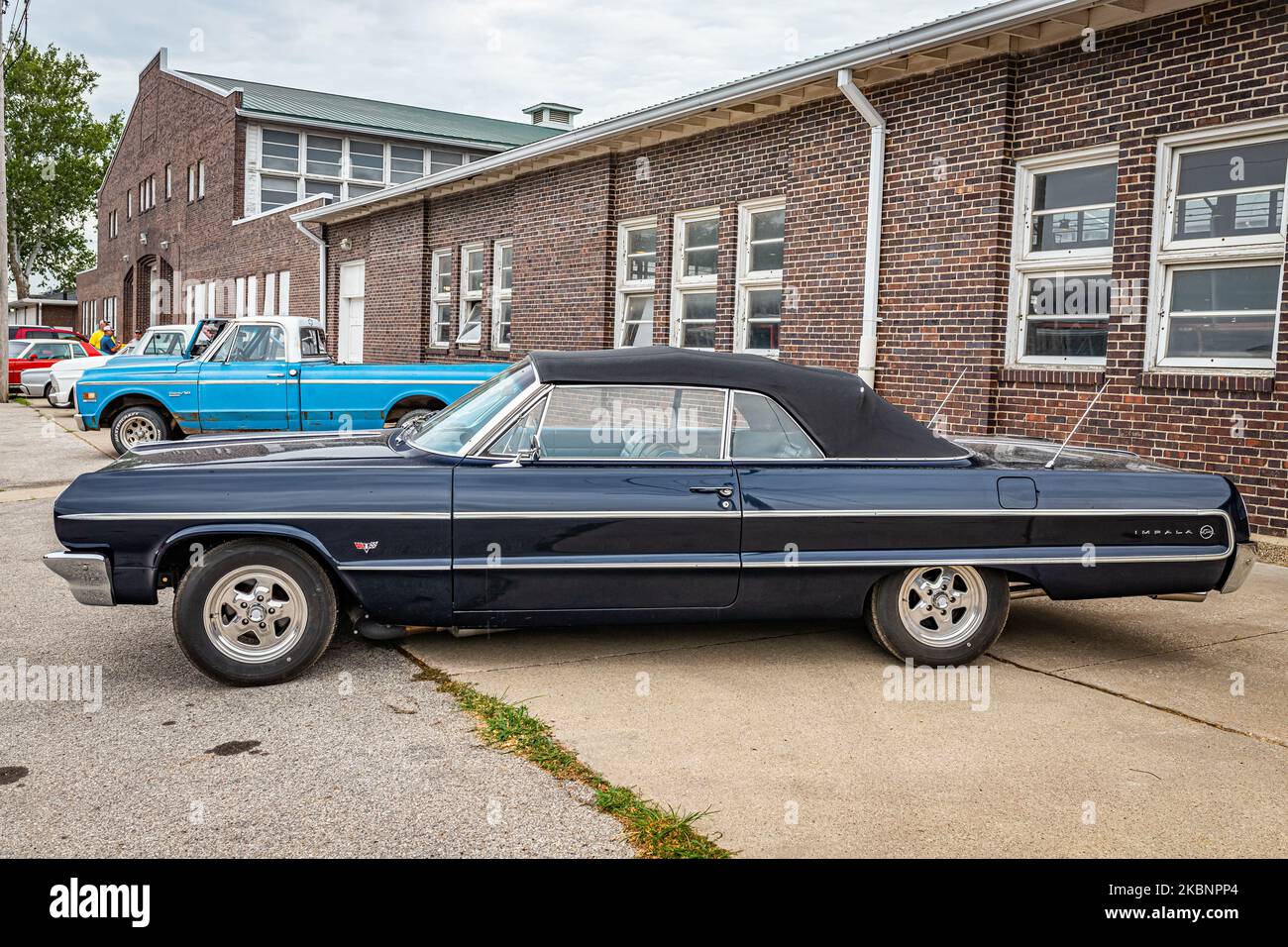 Des Moines, IA - July 01, 2022: High perspective side view of a 1964 Chevrolet Impala Convertible at a local car show. Stock Photo