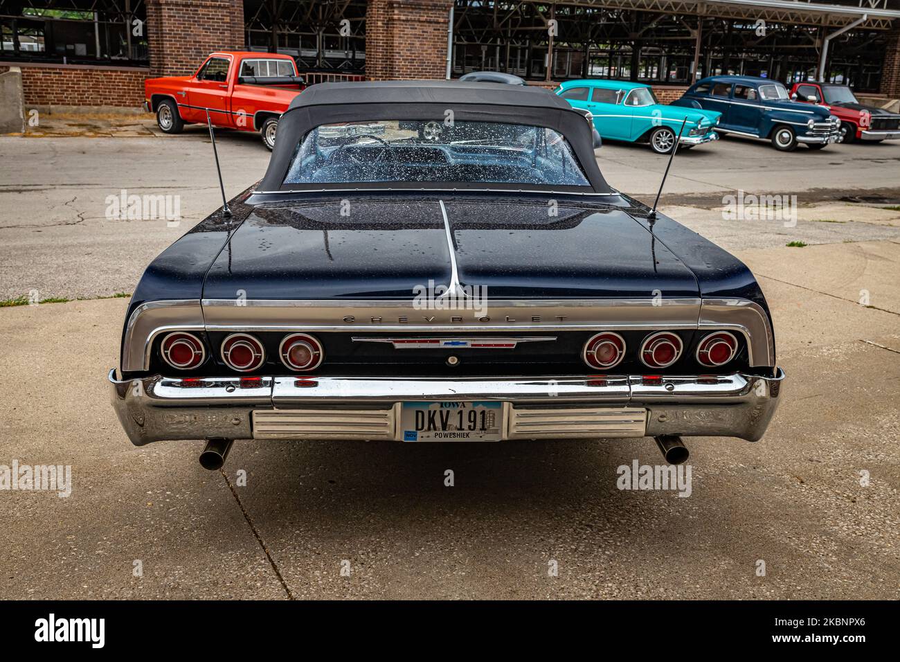 Des Moines, IA - July 01, 2022: High perspective rear view of a 1964 Chevrolet Impala Convertible at a local car show. Stock Photo