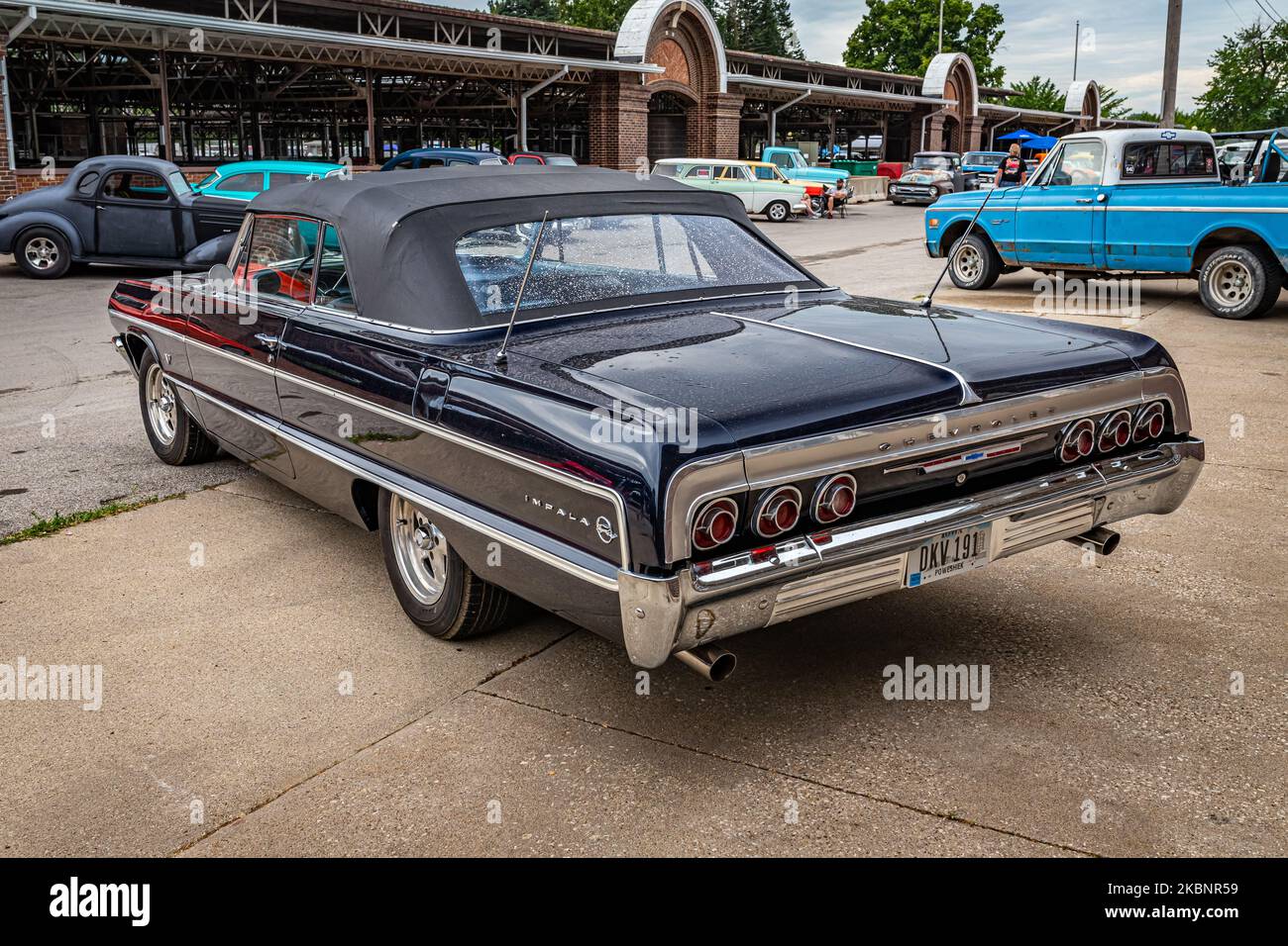 Des Moines, IA - July 01, 2022: High perspective rear corner view of a 1964 Chevrolet Impala Convertible at a local car show. Stock Photo