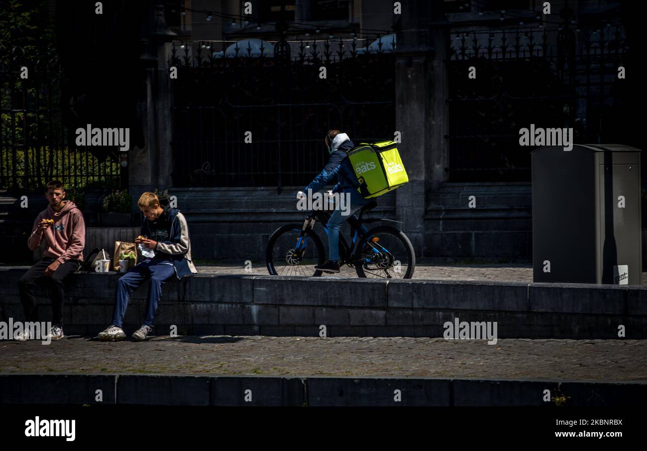 Uber Eats delivery courier on bicycle on his way to deliver fast food