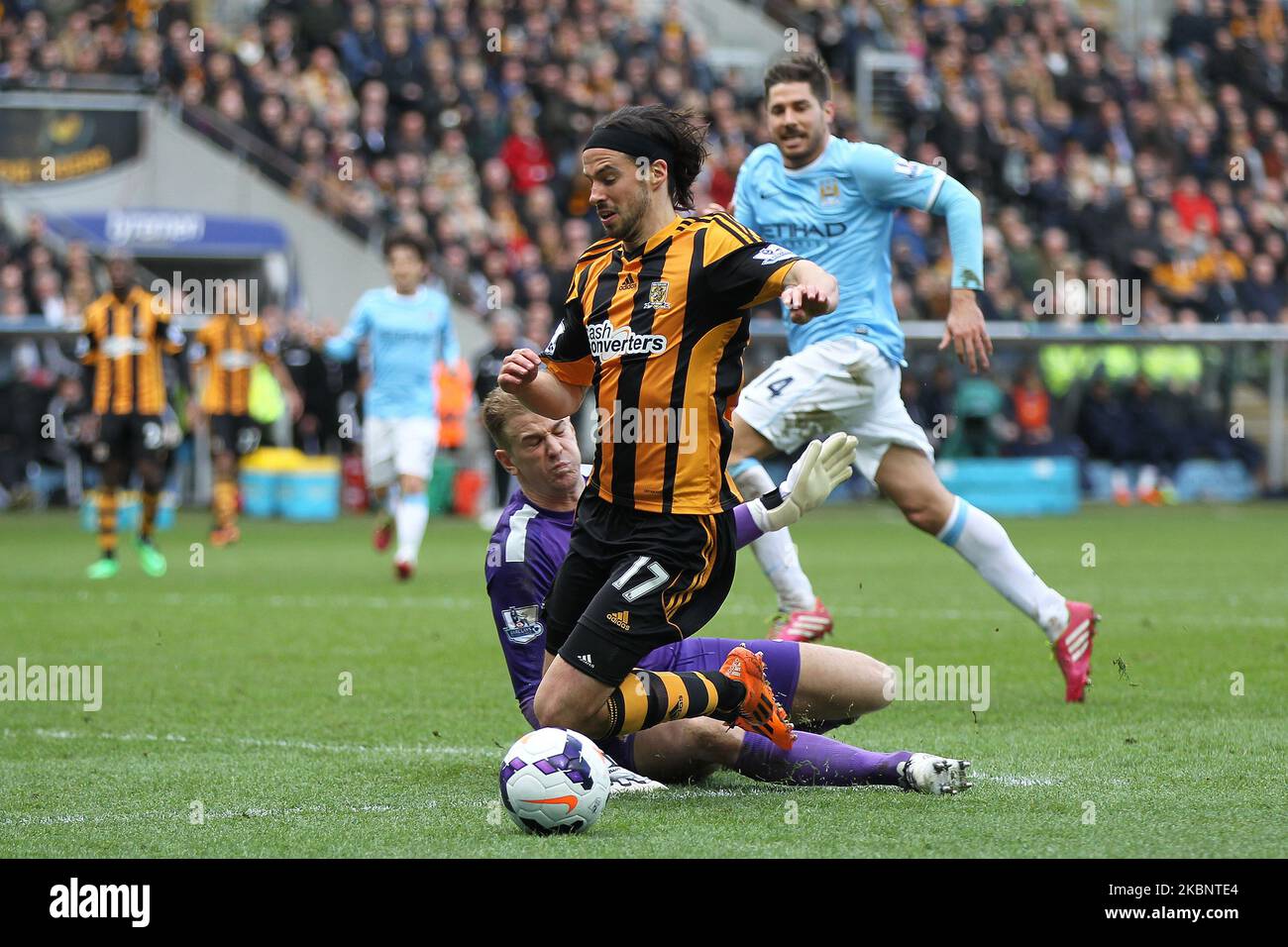 George Boyd of Hull City goes down in the penalty area after a Joe Hart challenge during the Premier League match between Hull City and Manchester City at the KC Stadium, Kingston upon Hull on Saturday 15th March 2014 (Photo by Mark Fletcher/MI News/NurPhoto) Stock Photo