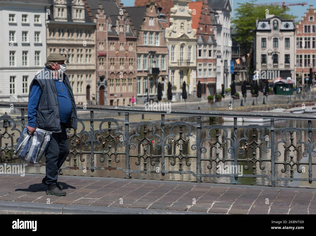 A man is seen walking with face mask as a precaution against transmission of the coronavirus in Ghent - Belgium 15 May 2020. Belgium compulsory face mask on public transport and strongly recommended in other places. Belgium start with the opening of shops allowing more people to work again,on condition. Belgium start cautiously with a way out of the corona measures.(Photo by Jonathan Raa/NurPhoto) Stock Photo