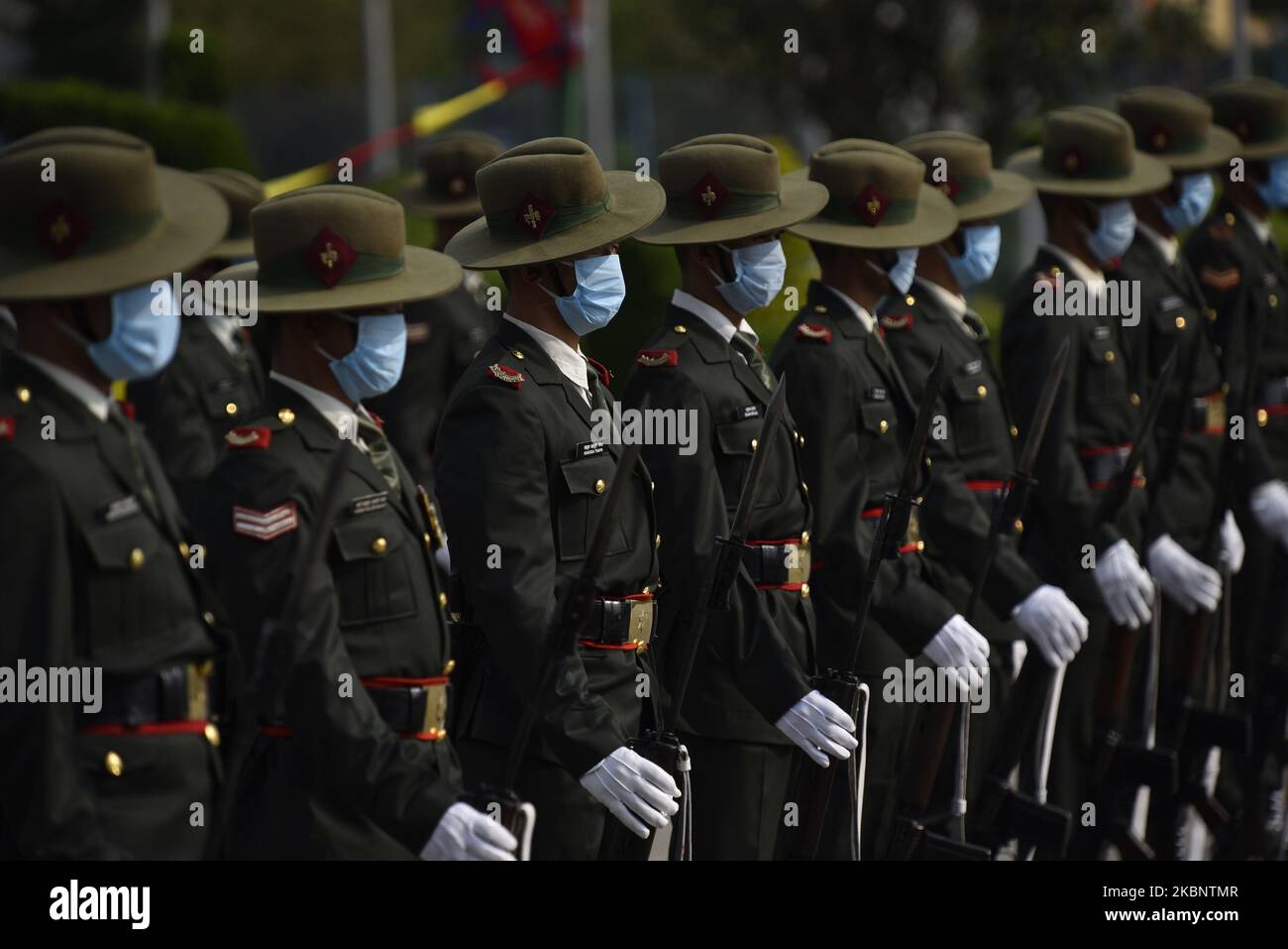 Nepalese Army personnel wearing facial mask as arrive to offer a guard of honor towards President Bidya Devi Bhandari arrives to present this fiscal year's policy and programs during complete nationwide lockdown as concerns about the spread of Corona Virus(COVID-19) at federal parliament in Kathmandu, Nepal on Friday, May 15, 2020. (Photo by Narayan Maharjan/NurPhoto) Stock Photo