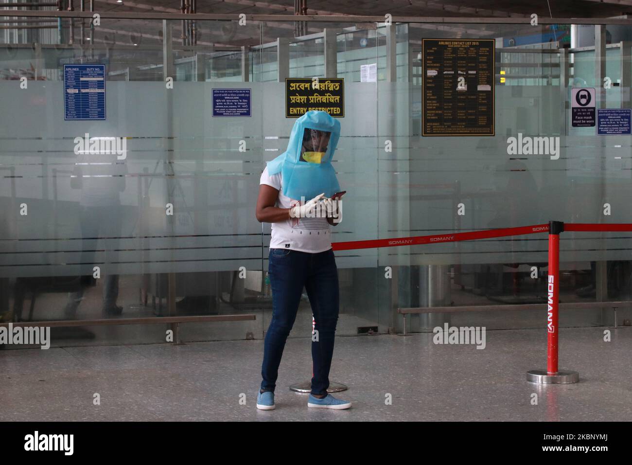 A women wearing protective gear wait for first repatriation flight to West Bengal under the Vande Bharat Mission landed at the Kolkata airport on Monday from Bangladesh with 169 people, including 16 in need of medical emergency treatment and a pregnant woman, officials said. The plane that took off from Dhaka arrived at the Netaji Subhas Chandra Bose International Airport on May 18,2020 in Kolkata ,India. (Photo by Debajyoti Chakraborty/NurPhoto) Stock Photo