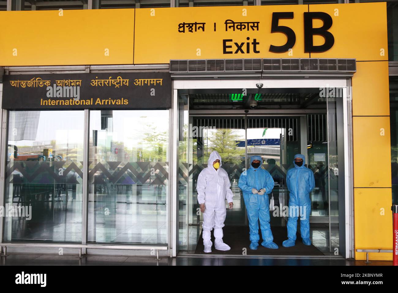 Health Worker wait to screen passenger traveling fro Bangladesh during a nationwide lockdown imposed as a preventive measure against the COVID-19 coronavirus on May 18,2020 in NSCBI Air Port in Kolkata,India.The first repatriation flight to West Bengal under the Vande Bharat Mission landed at the Kolkata airport on Monday from Bangladesh with 169 people, including 16 in need of medical emergency treatment and a pregnant woman,External Affairs Minister S Jaishankar welcomed the passengers and thanked the Ministry of Civil Aviation and the West Bengal government for working in coordination to fa Stock Photo