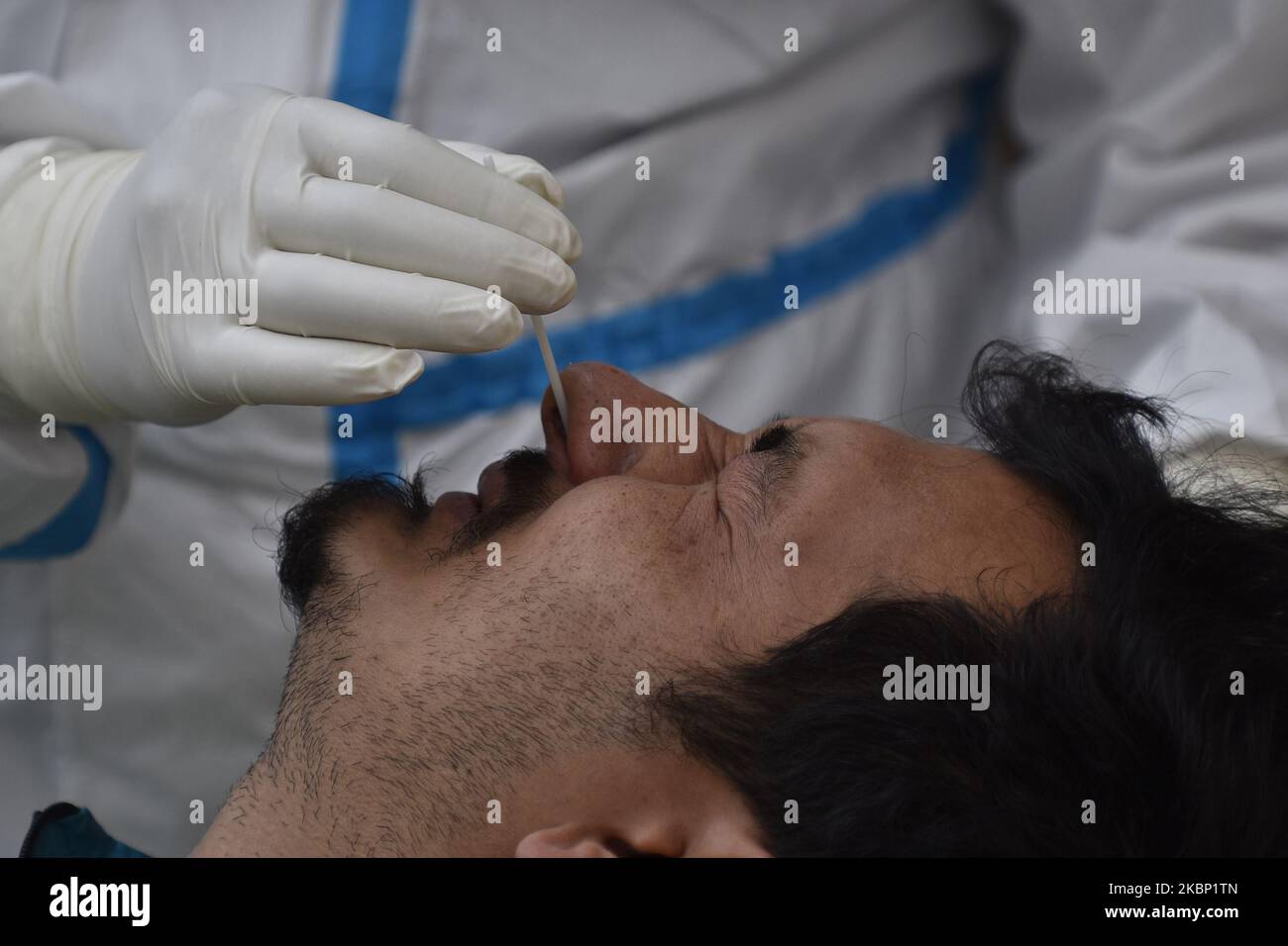 A Nepalese Health personnel in protective gear ready to collect nasal