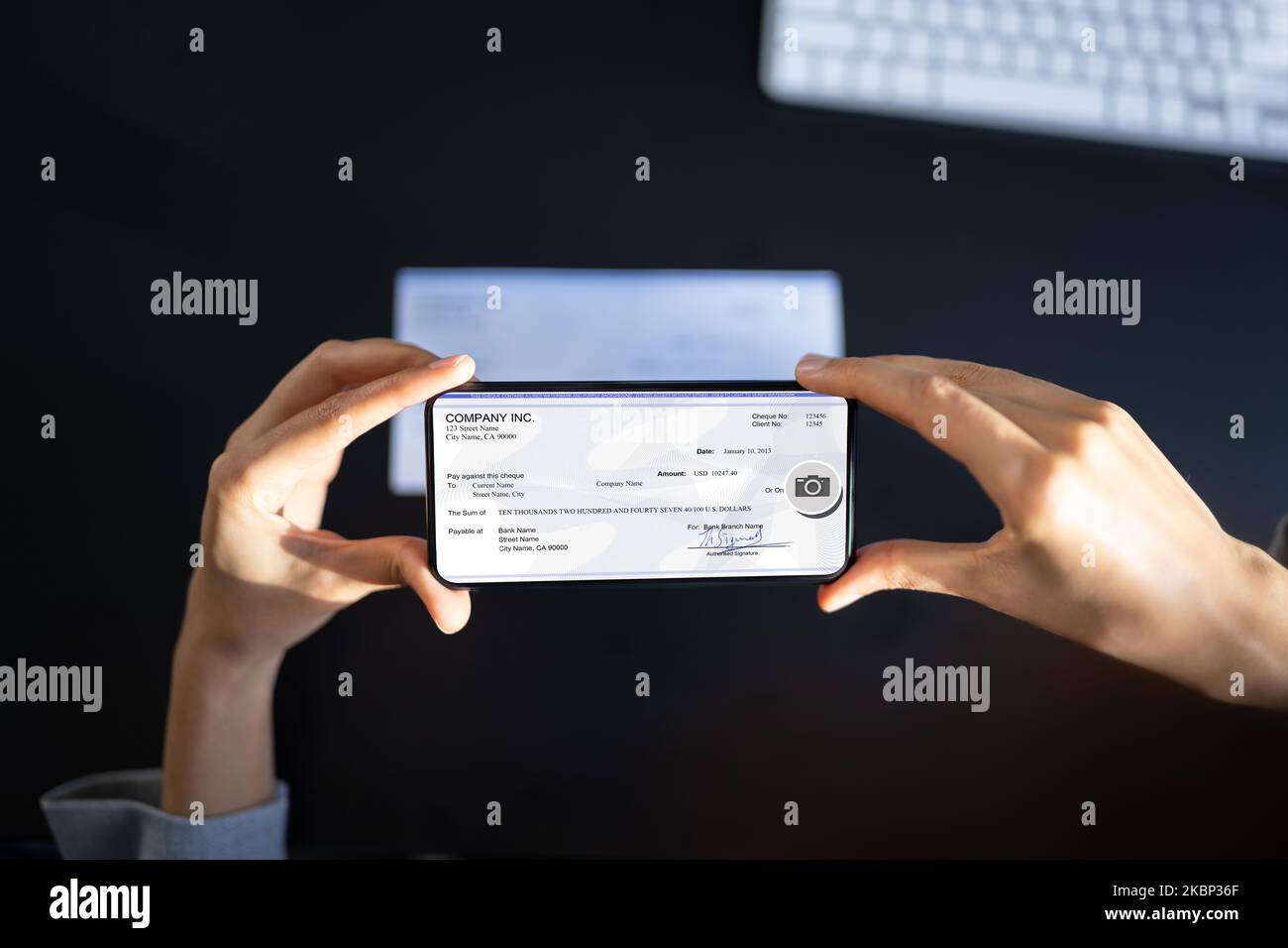 Remote Check Deposit Taking Photo With Mobile Phone Stock Photo - Alamy