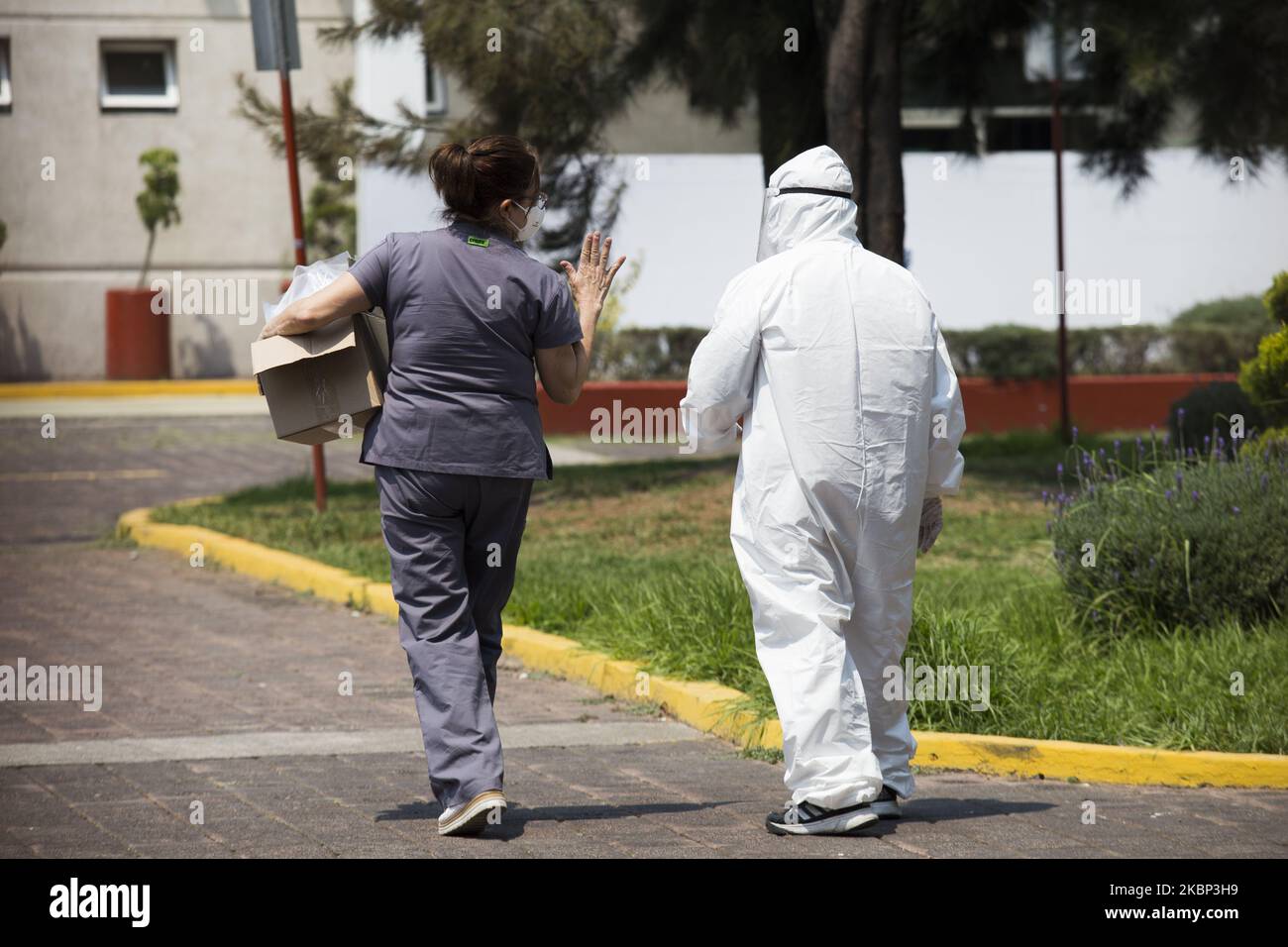 Relatives of people affected by Covid-19, await for reports on the health status of their relatives in the vicinity of the Dr. Matilde Petra Montoya Lafragua General Hospital in Tlahuac, Mexico City, on May 20, 2020. (Photo by Cristian Leyva/NurPhoto) Stock Photo