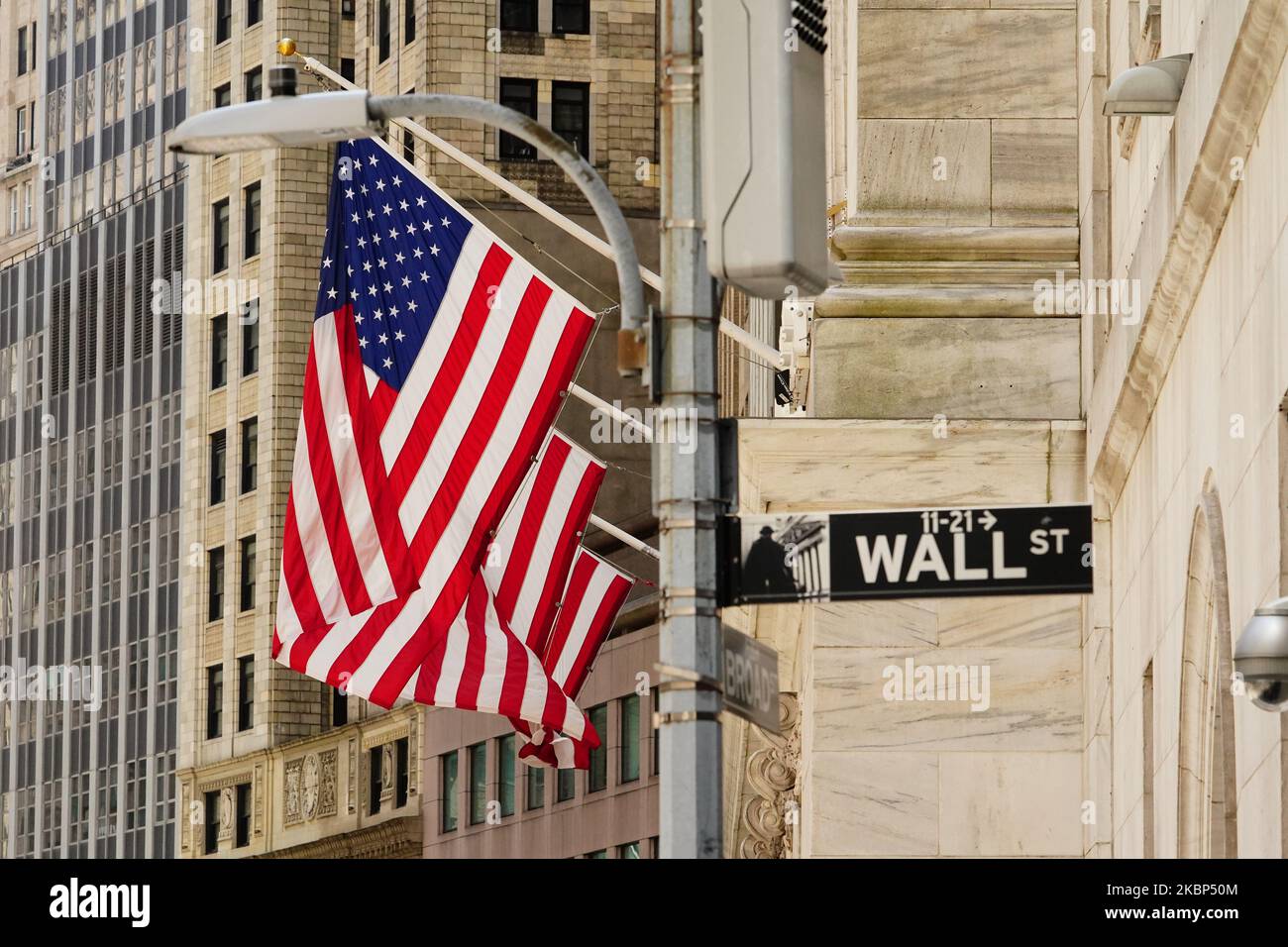 A view of american flags at New York Stock Exhange during the coronavirus pandemic on May 20, 2020 in Wall Street, New York City. COVID-19 has spread to most countries around the world, claiming over 316,000 lives with over 4.8 million infections reported. (Market Watch)— Dow, S&P 500 weakness belie positive NYSE market breadth. (Photo by John Nacion/NurPhoto) Stock Photo