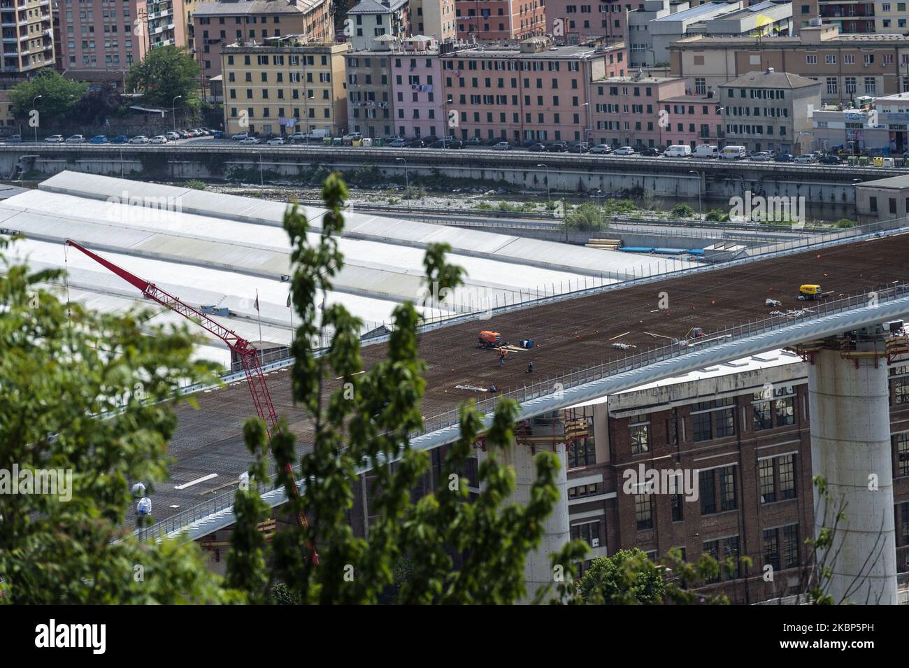 View of the new viaduct that will connect Genoa again from east to west on May 22, 2020 in Genoa, Italy. The new bridge will consist of a steel deck, with a continuous girder of a total length of 1067 meters consisting of 19 spans. The last span of the bridge designed by architect Renzo Piano has just been fixed. (Photo by Fabrizio Di Nucci/NurPhoto) Stock Photo