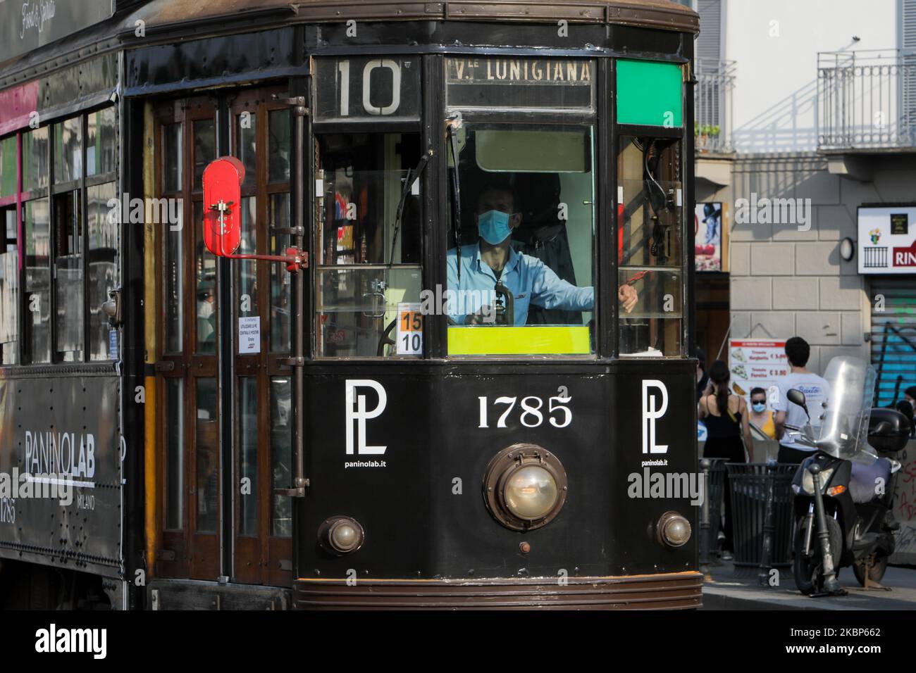 The driver of a tram wears a protective mask during the work shift in Navigli at the beginning of the weekend in Milan on May 22, 2020 in Milan, Italy. Restaurants, bars, cafes, hairdressers and other shops have reopened, subject to social distancing measures, after more than two months of a nationwide lockdown meant to curb the spread of Covid-19 (Photo by Mairo Cinquetti/NurPhoto) Stock Photo