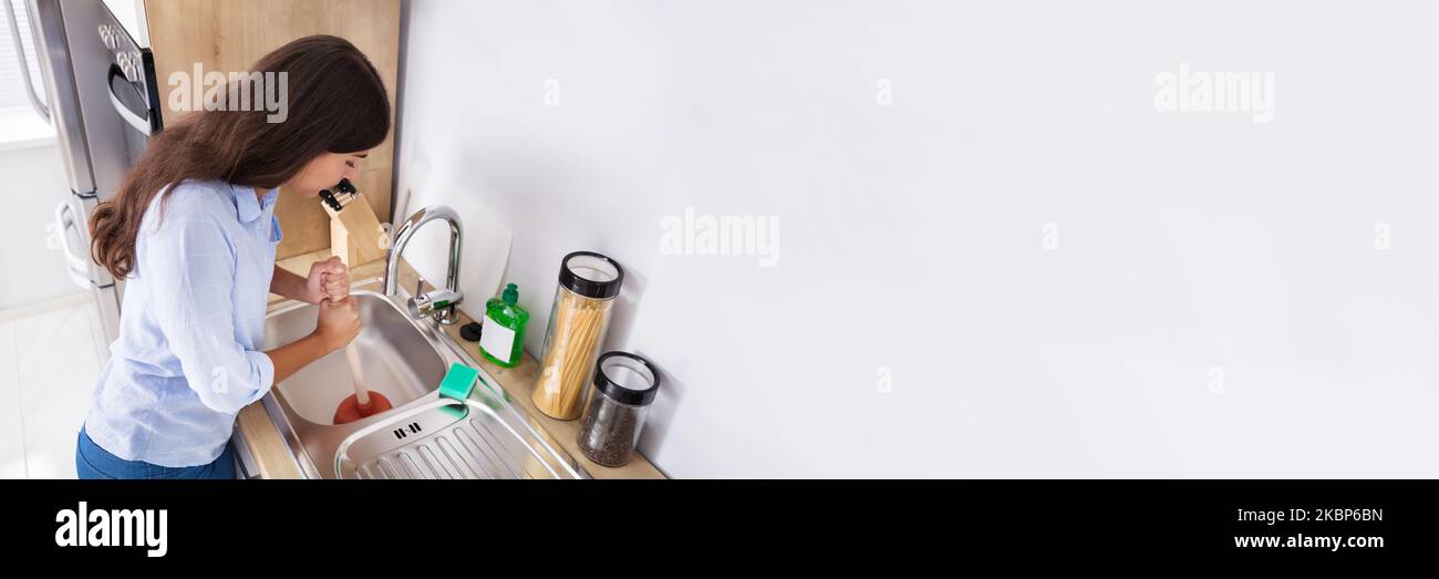 Cleaning Blocked Drain Sink. Kitchen Sewer Unclog With Plunger Stock Photo Alamy