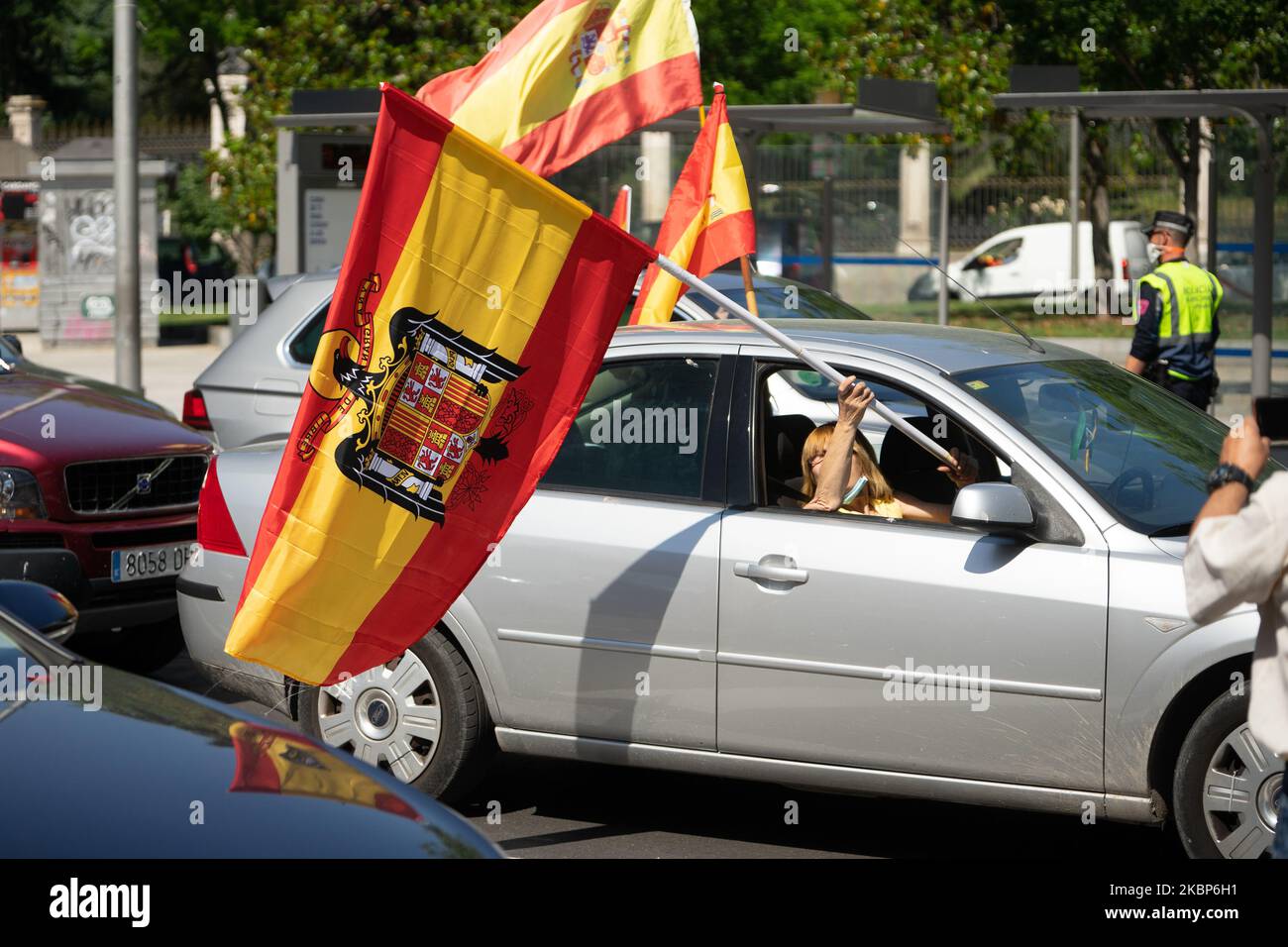 A man with the Francoist flag in the ''Caravan for Spain and its Freedom'' that has been held in the streets of Madrid and other provincial capitals on May 23, 2020 in Madrid, Spain. (Photo by Jon Imanol Reino/NurPhoto) Stock Photo