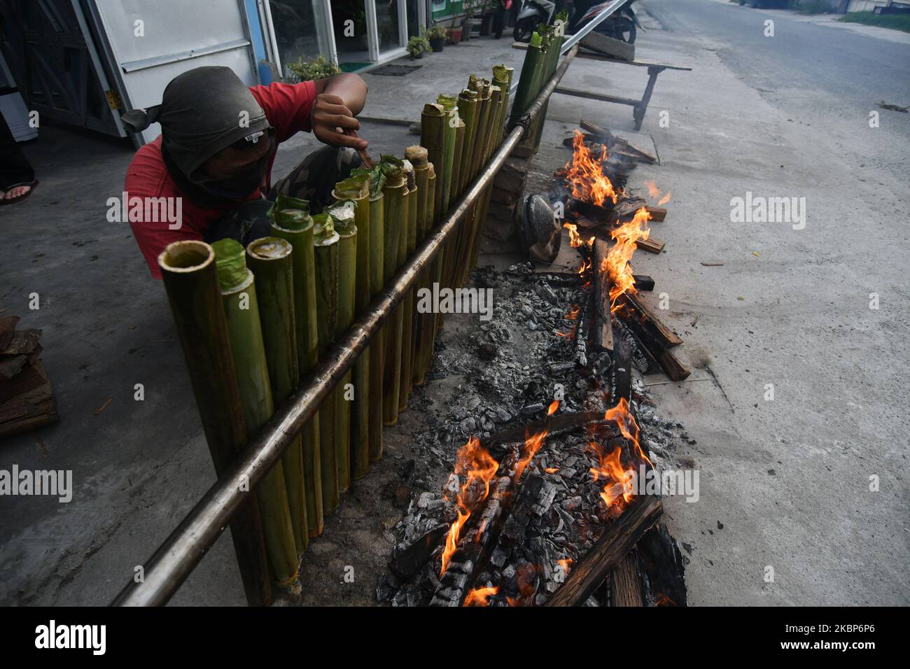 Residents roast rice mixed with traditional spices and filled into ...