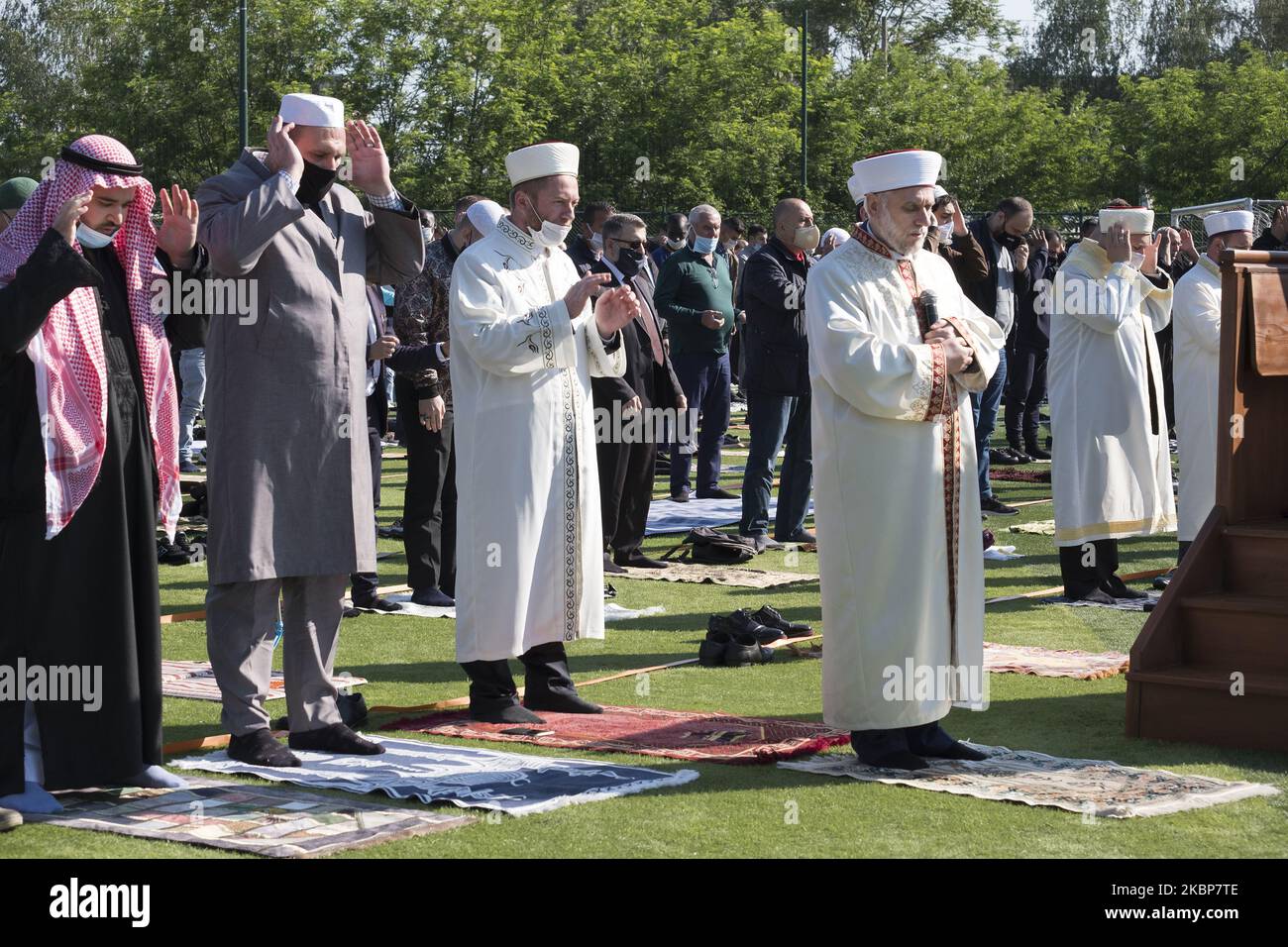 Dr. Mustafa Hadzhi, Grand Mufti of Bulgaria, leads prayers for hundreds of Muslims gathered to celebrate Eid al-Fitr on a soccer field at Lokomotiv Stadium in Sofia, Bulgaria on May 24, 2020. Due to the coronavirus restrictions, the central mosque is closed. Participants came from many different countries and the sermon was given in Bulgarian, Turkish and Arabic. (Photo by Jodi Hilton/NurPhoto) Stock Photo