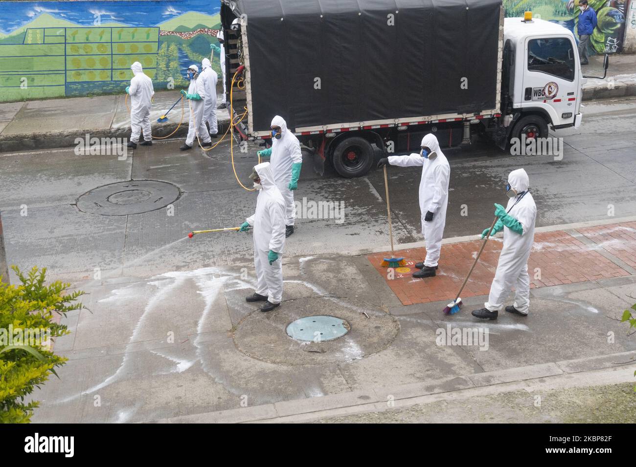 Soldiers from the Military Police Battalion during a cleaning, disinfection and spraying session in the La Mariposa Mariposa sector to counter the spread of the corona virus, COVID 19 on May 23, 2020 in Bogota, Colombia. (Photo by Daniel Garzon Herazo/NurPhoto) Stock Photo