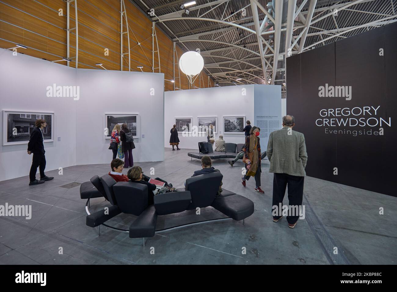 TURIN, ITALY - NOVEMBER 03, 2022: Artissima 2022, Gregory Crewdson exhibition with people and art collectors at contemporary art fair vernissage Stock Photo