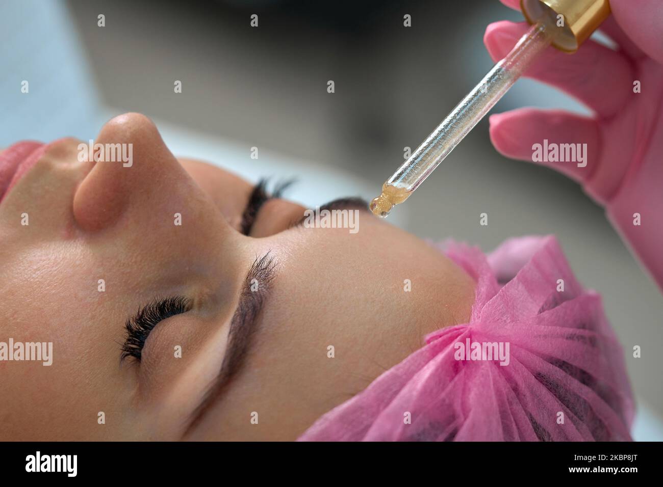 girl gets cosmetology services on her face Stock Photo
