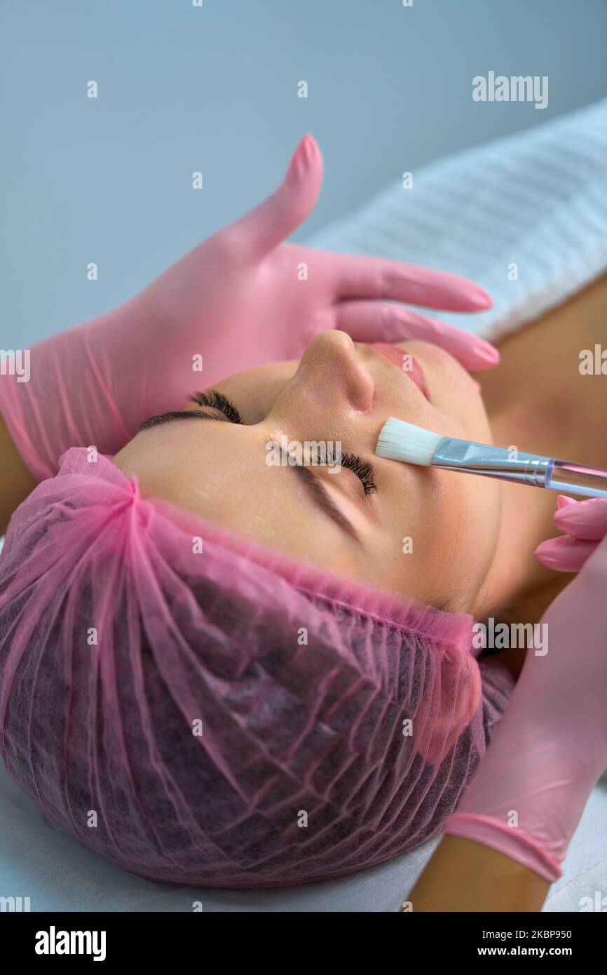 girl gets cosmetology services on her face Stock Photo