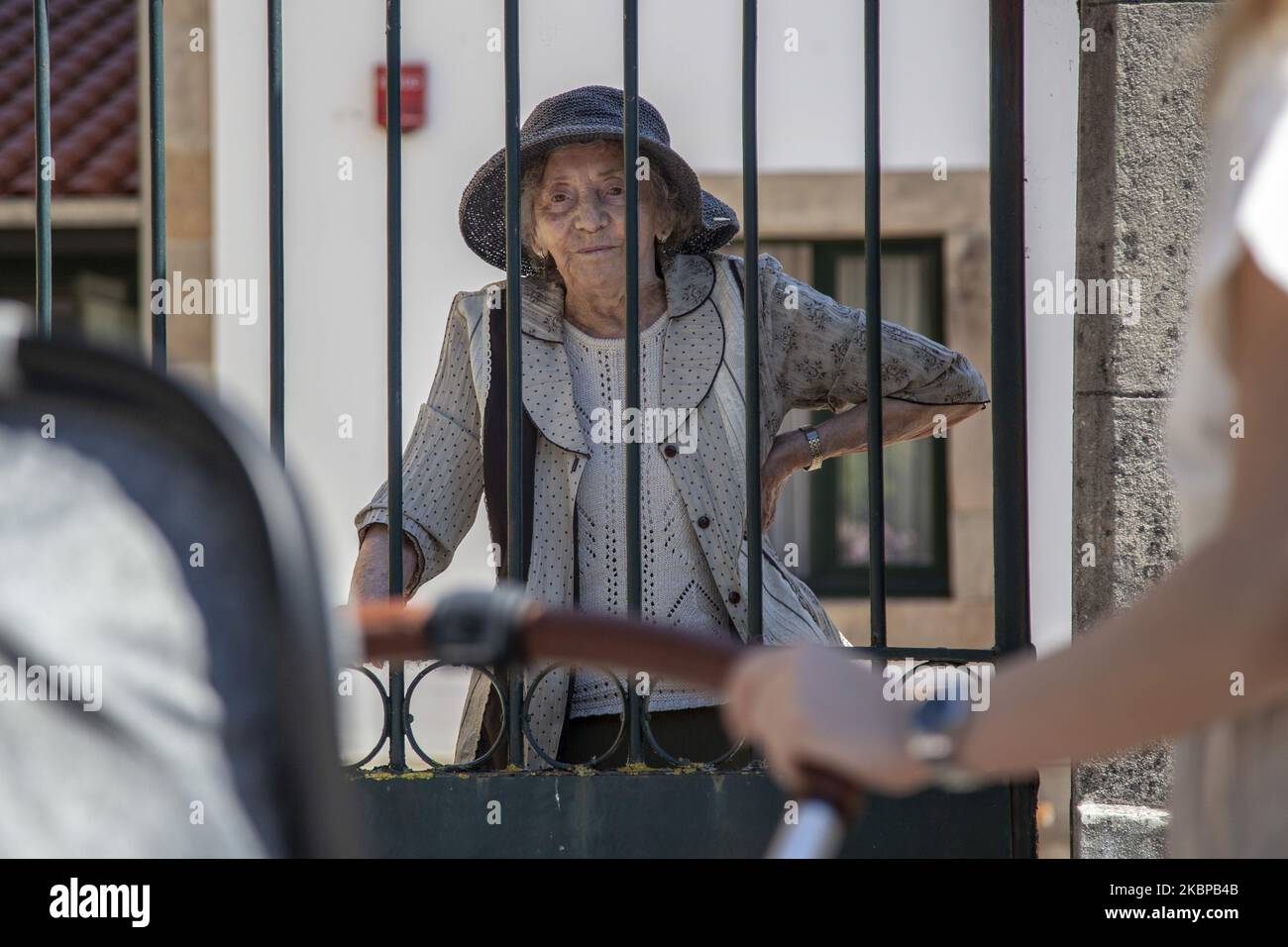Four generations of women gather at the gate of the Llano Ponte nursing