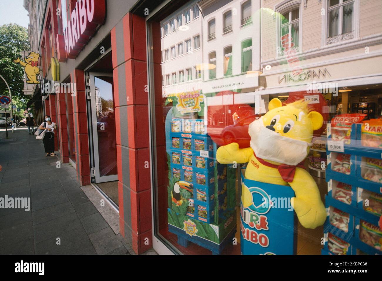 A Haribo Gold Bear with face mask is seen in a Haribo store in Bonn, Germany, on May 28, 2020. (Photo by Ying Tang/NurPhoto) Stock Photo