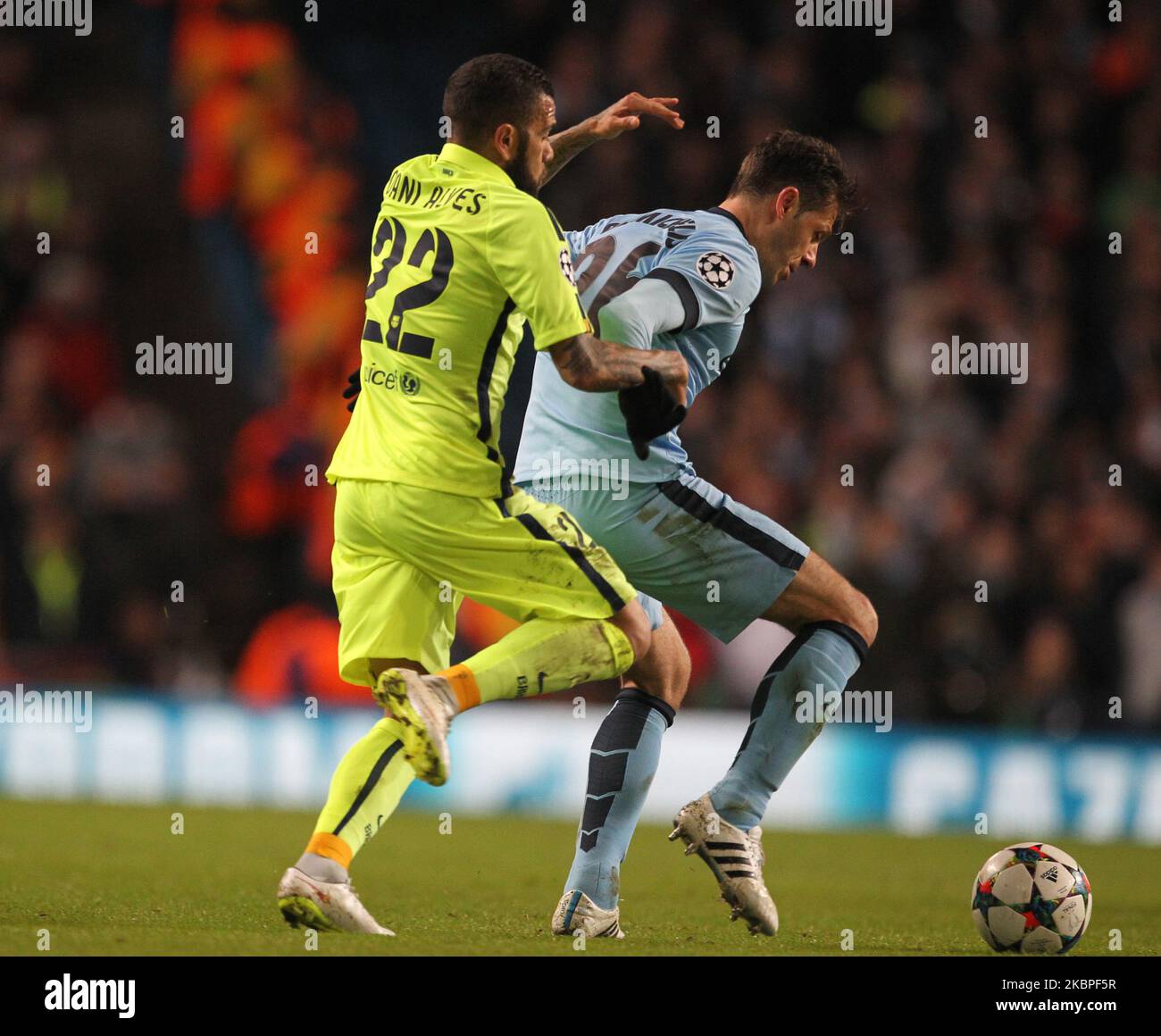 Martin Demichelis of Manchester City battles with Dani Alves da Silva of Barcelona during the UEFA Champions League Round of 16 1st Leg between Manchester City and FC Barcelona at the Etihad Stadium, Manchester on Tuesday 24th February 2015 (Photo by Mark Fletcher/MI News/NurPhoto) Stock Photo