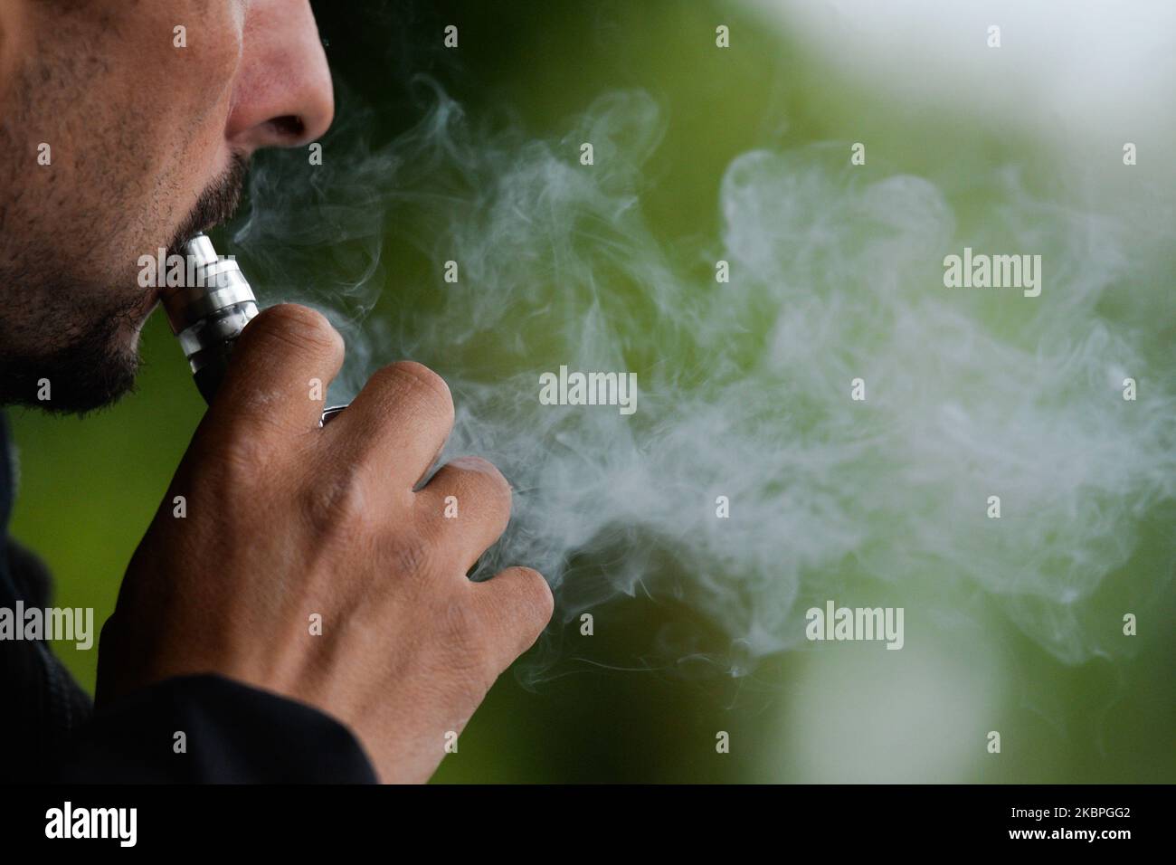 A man smokes an electronic cigarette on World No-Tobacco Day. On Sunday,  May 31, 2020, Krakow, Poland (Photo by Artur Widak/NurPhoto Stock Photo -  Alamy
