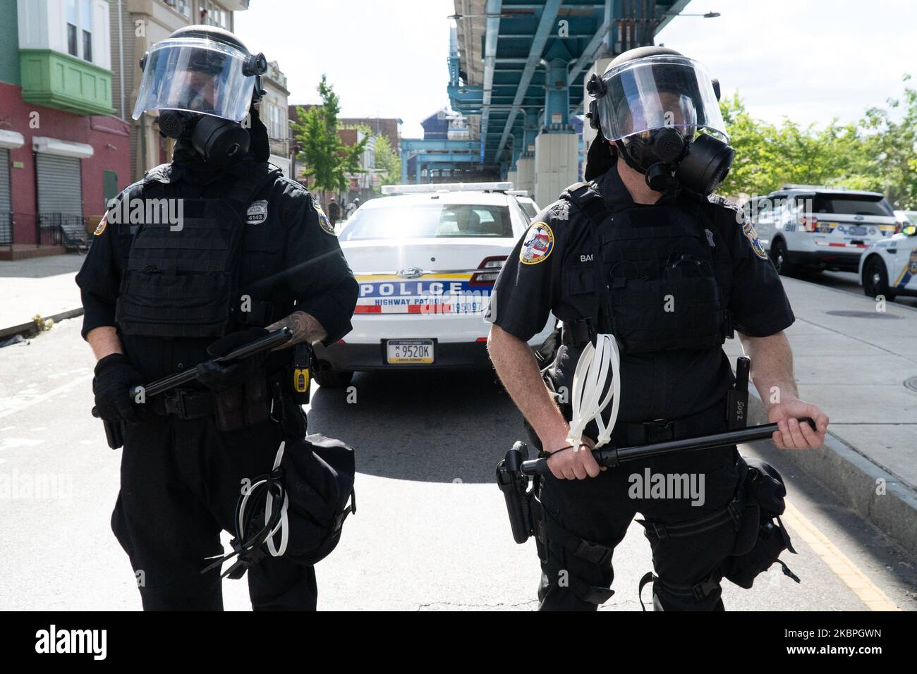 Philadelphia police in riot gear block Market Street after looting and ...