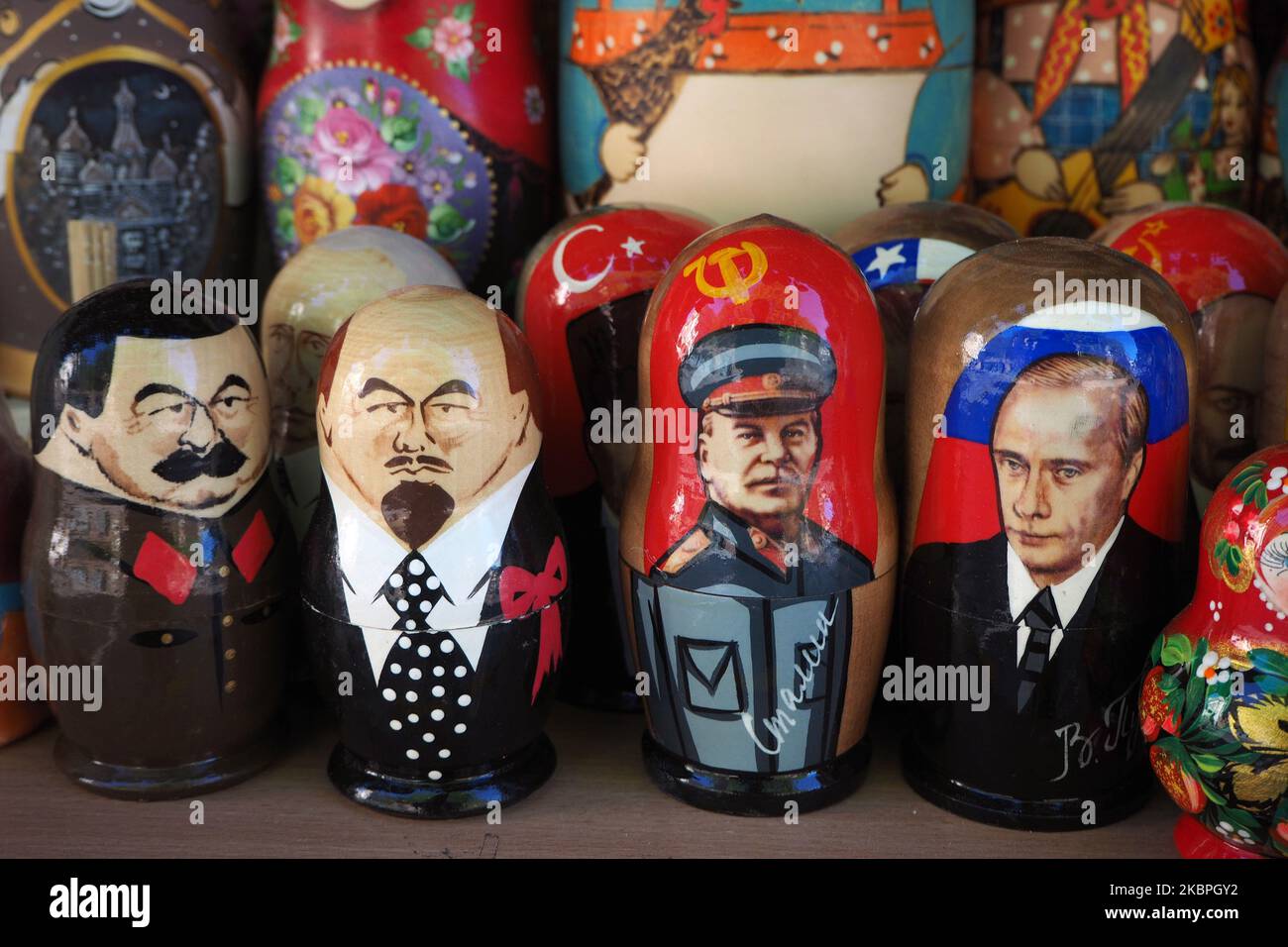 Painted Matryoshka dolls also known as Russian nesting dolls, bearing the faces of former leaders of the Soviet Union Josef Stalin and Vladimir Lenin and Russian President Vladimir Putin on display in a souvenir shop in St. Petersburg, Russia, on May 31, 2020. (Photo by Sergey Nikolaev/NurPhoto) Stock Photo